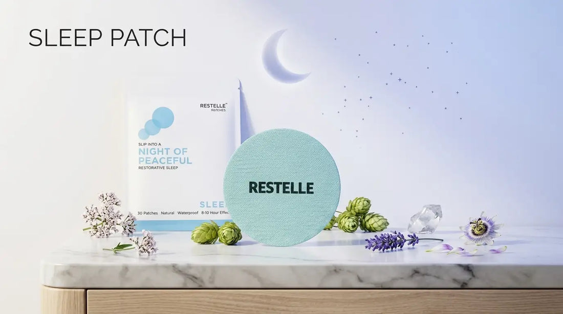 Restelle sleep patch and pouch on a marble table with lavender, hops, and flowers, set against a dreamy night-sky backdrop with a crescent moon.