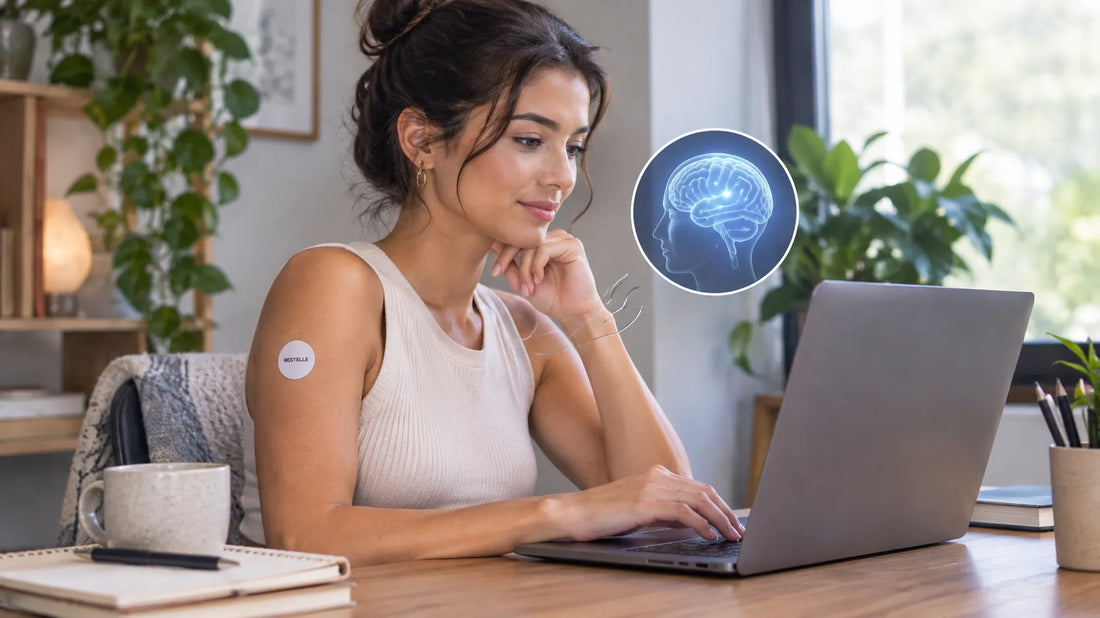 Woman working at a laptop with a Restelle focus patch on her arm and a glowing brain graphic illustrating enhanced mental energy