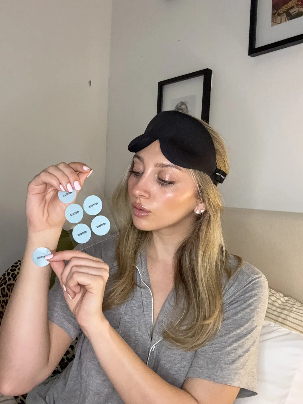 Leanne holding a sheet of RESTELLE patches